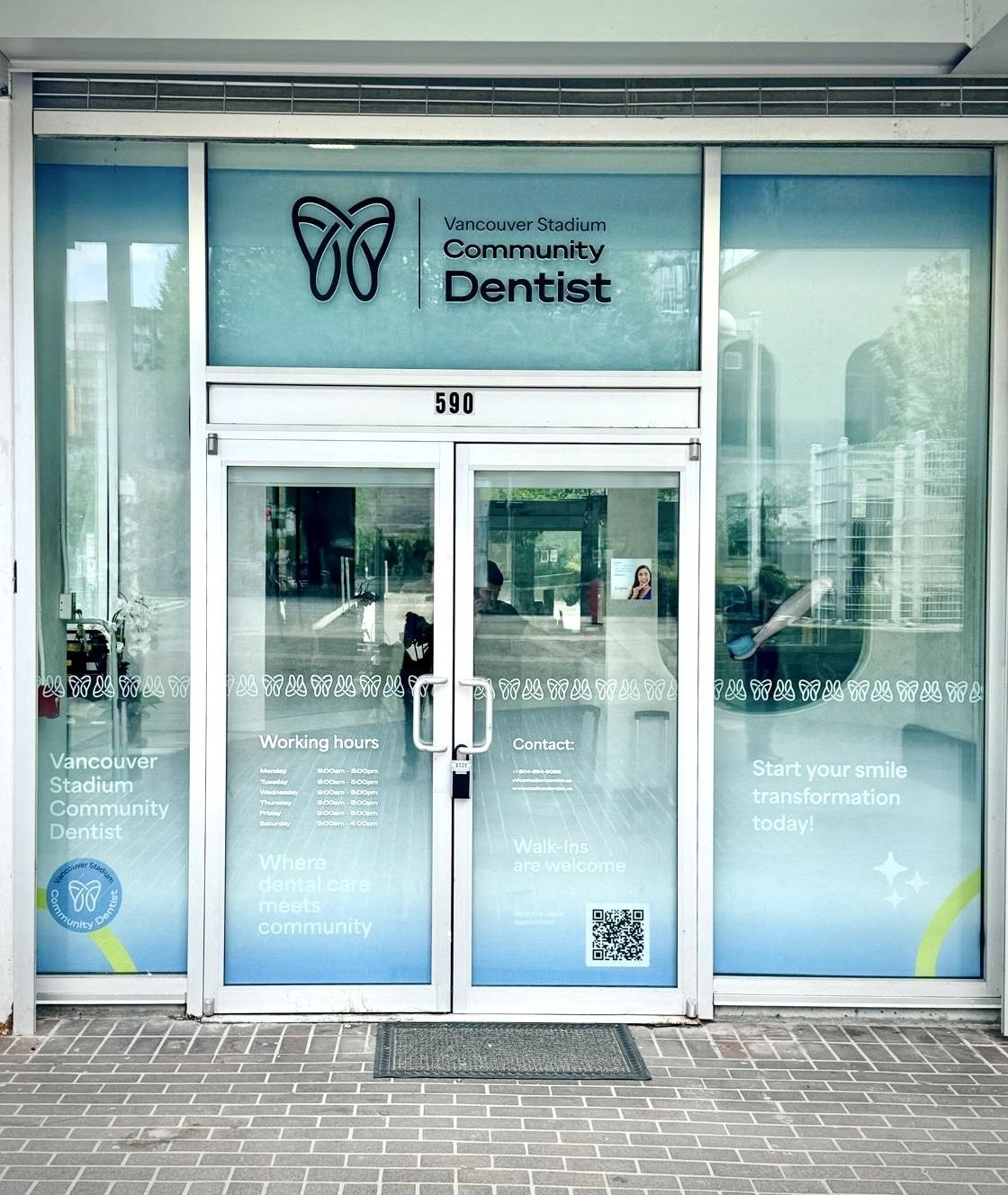 Large format printed window graphics on a storefront entrance in Vancouver